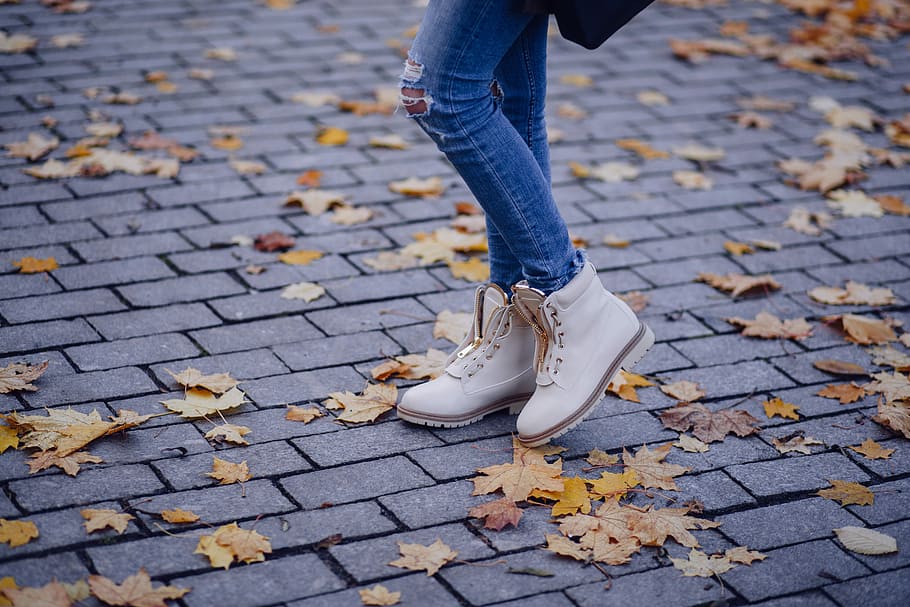 person wearing work boot, person wearing pair of white boots standing on ground with dried leaves falling, HD wallpaper