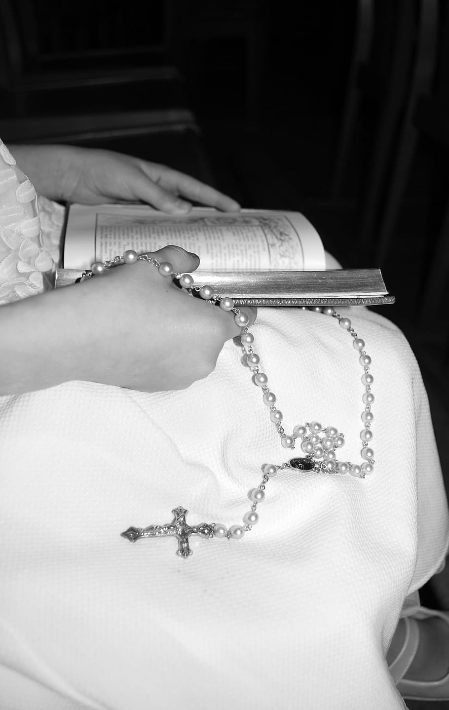 catholic cross, white dress, rosary, missal, human hand, human body part