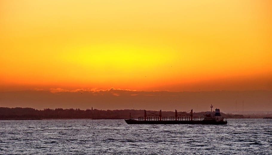 HD wallpaper: barge on body of water during golden hour, Sunset, Ocean ...