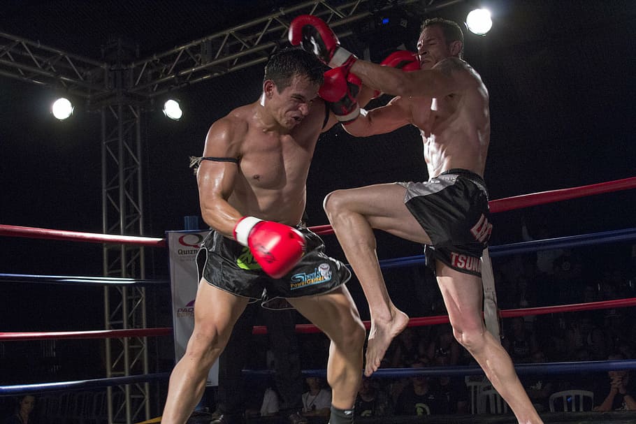 two male Muay-Thai fighters inside ring fighting, sport, action