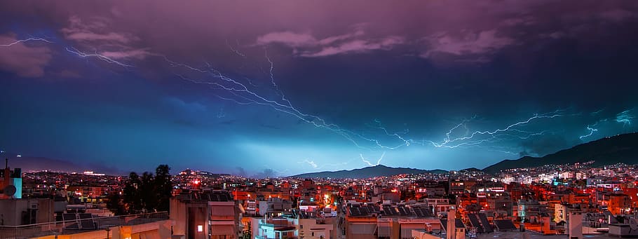aerial photography of buildings over lightning thunder sky HD wallpaper