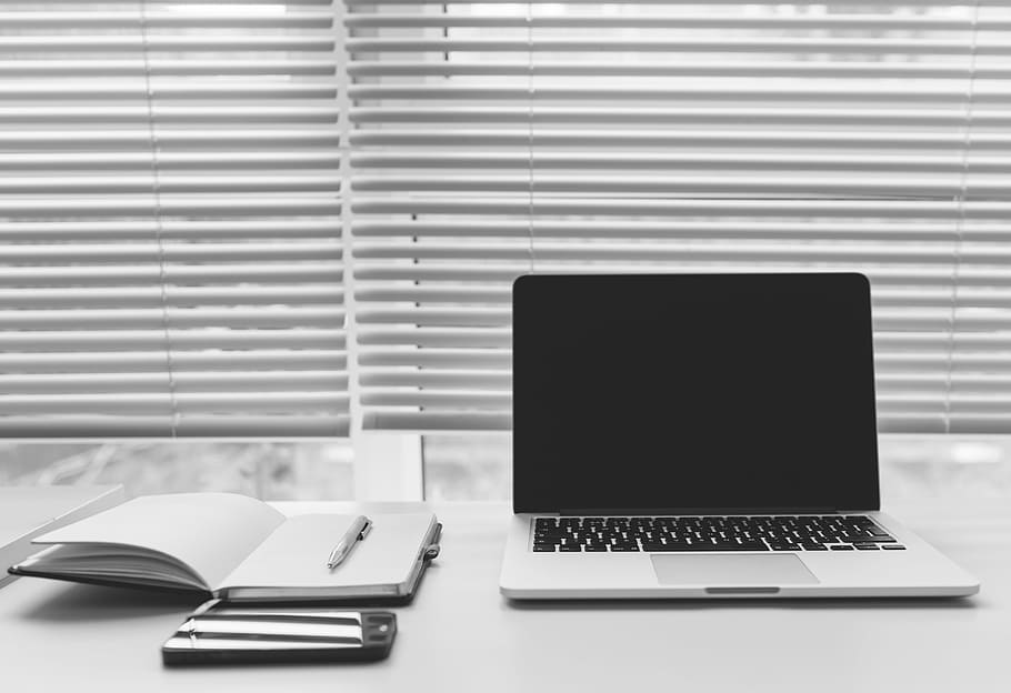 MacBook Pro beside open notebook, laptop, computer, technology HD wallpaper