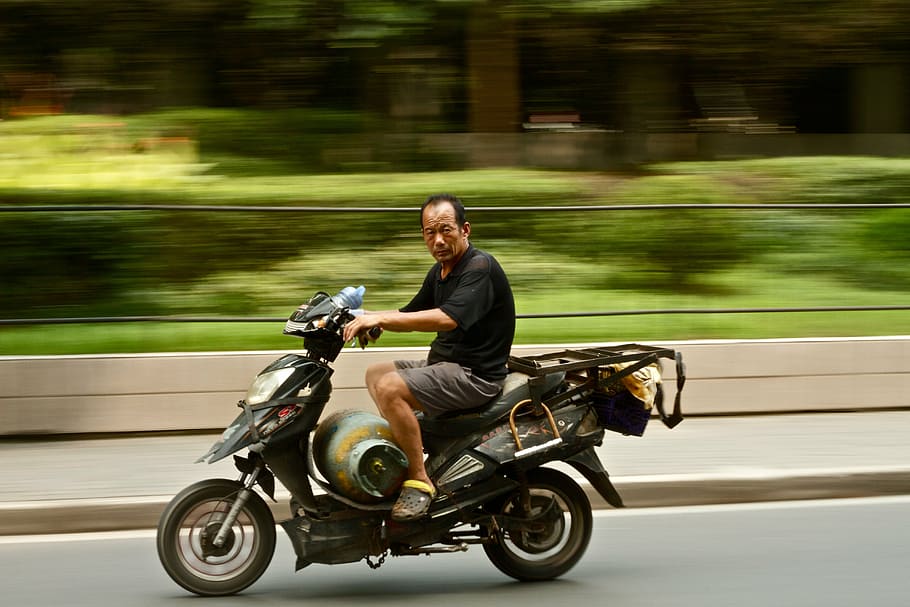 man riding motorcycle, guy, road, gas, tank, trees, grass, way HD wallpaper