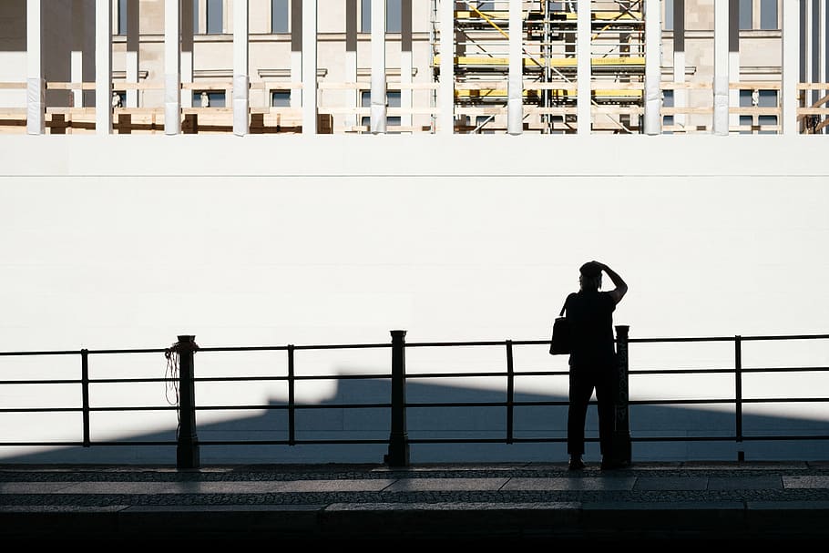 silhouette of person standing beside white wall, architecture HD wallpaper