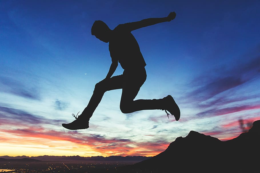 silhouette of jumping man near mountain, valley, cliff, hill HD wallpaper