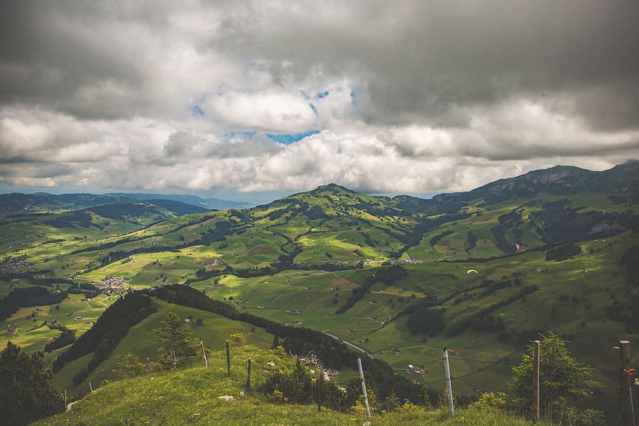 aerial view of mountain under gray sky, aerial view of mountain under cloudy skies HD wallpaper