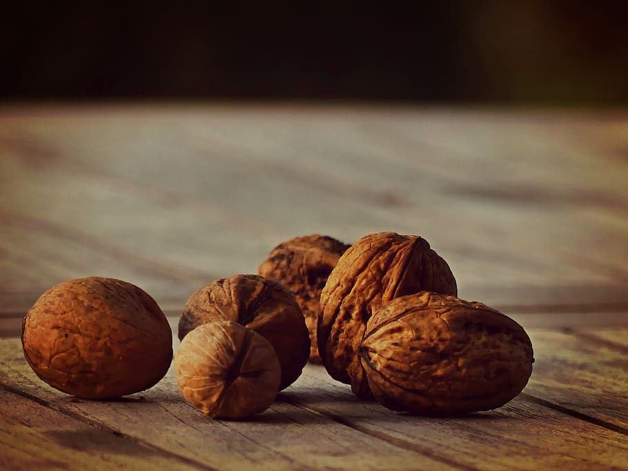 walnuts in brown surface, food, shell, fruit bowl, close, tree fruit HD wallpaper