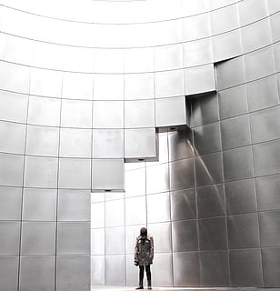 person standing under metal block building, person inside room HD wallpaper