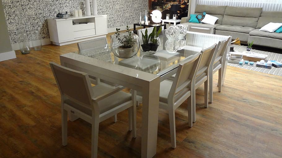 seven white wooden chairs and white clear glass table near gray fabric sofa HD wallpaper