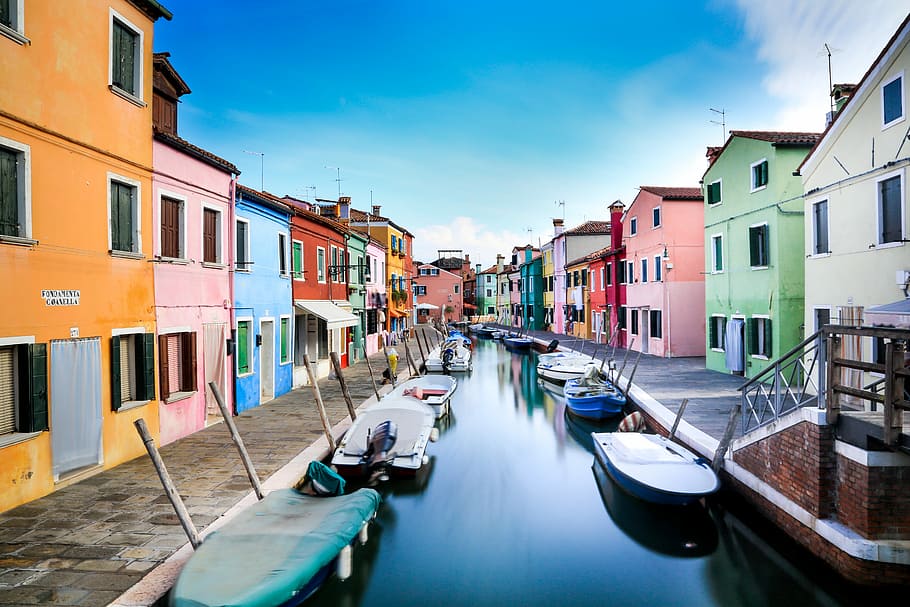 boats on canal between houses during daytime, assorted boat lot HD wallpaper