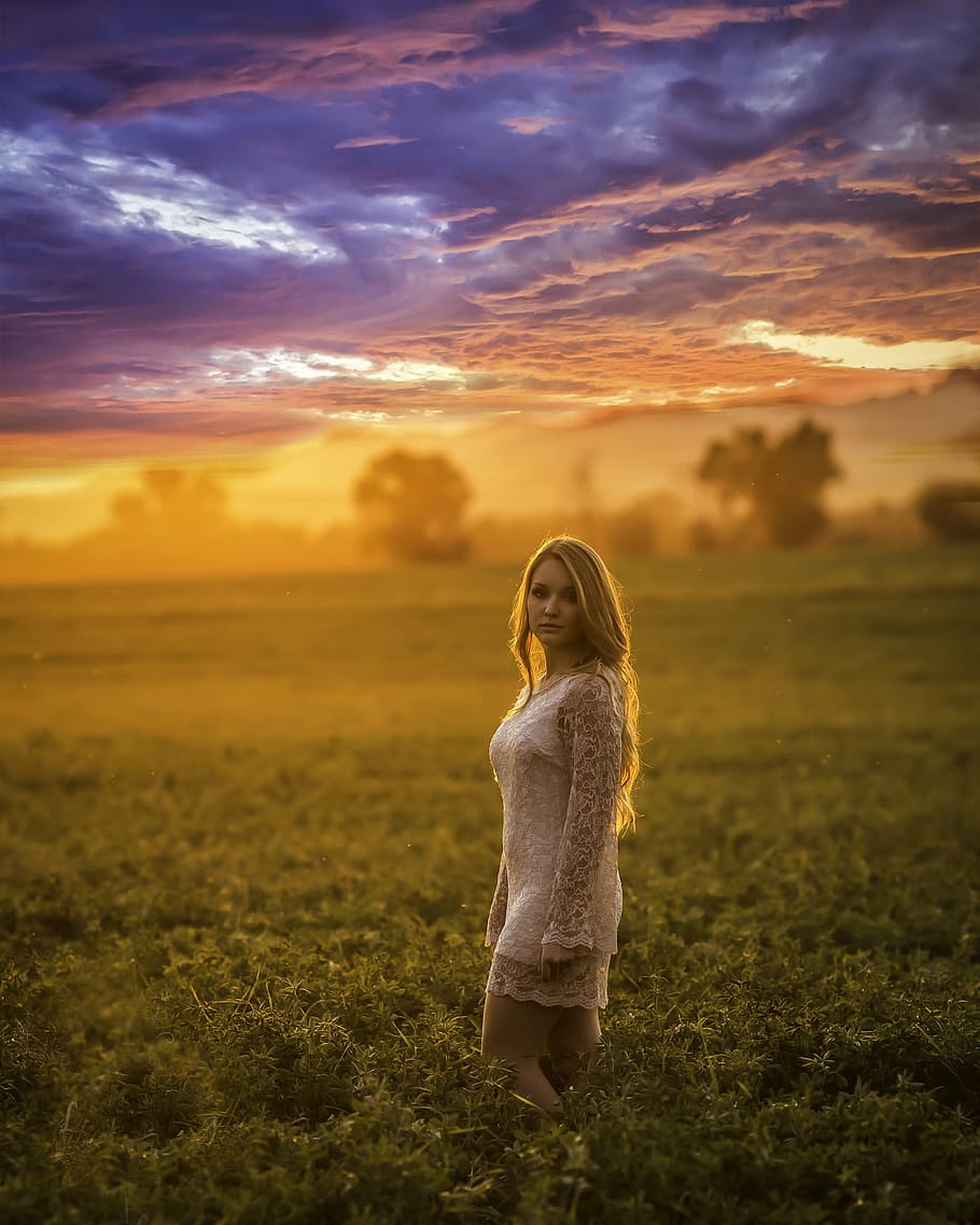 woman standing on green grass field, sunset, model, beautiful HD wallpaper