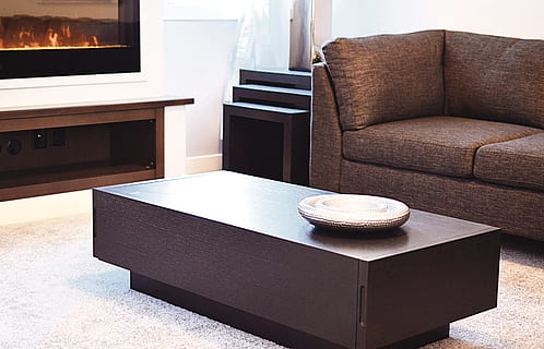 round grey metal plate on a brown wooden coffee table, living room HD wallpaper