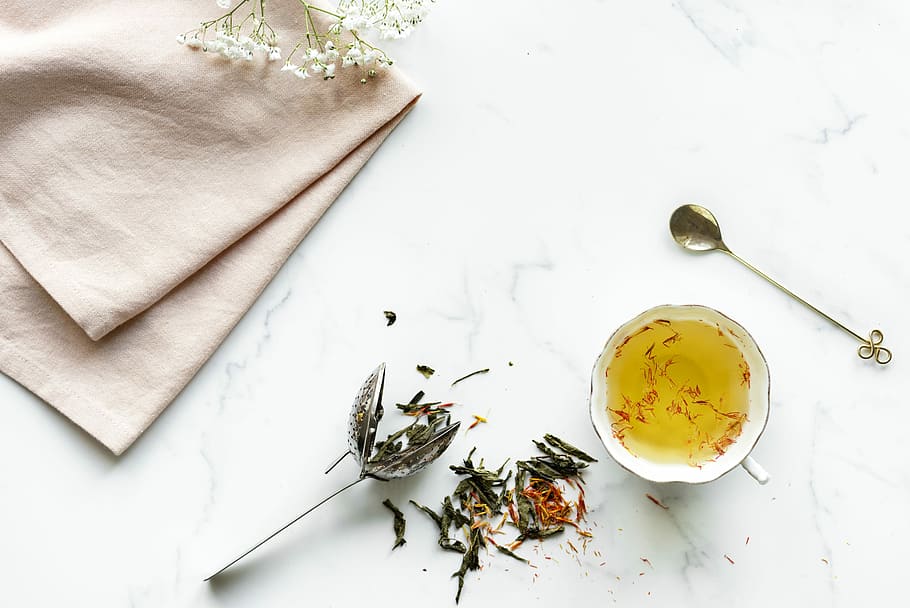teacup near spoon, flower, table, saffron, plant, indoors, food and drink HD wallpaper