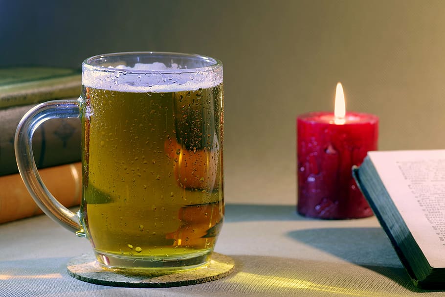 glass of liquid beside red lighted candle, beer, book, read HD wallpaper