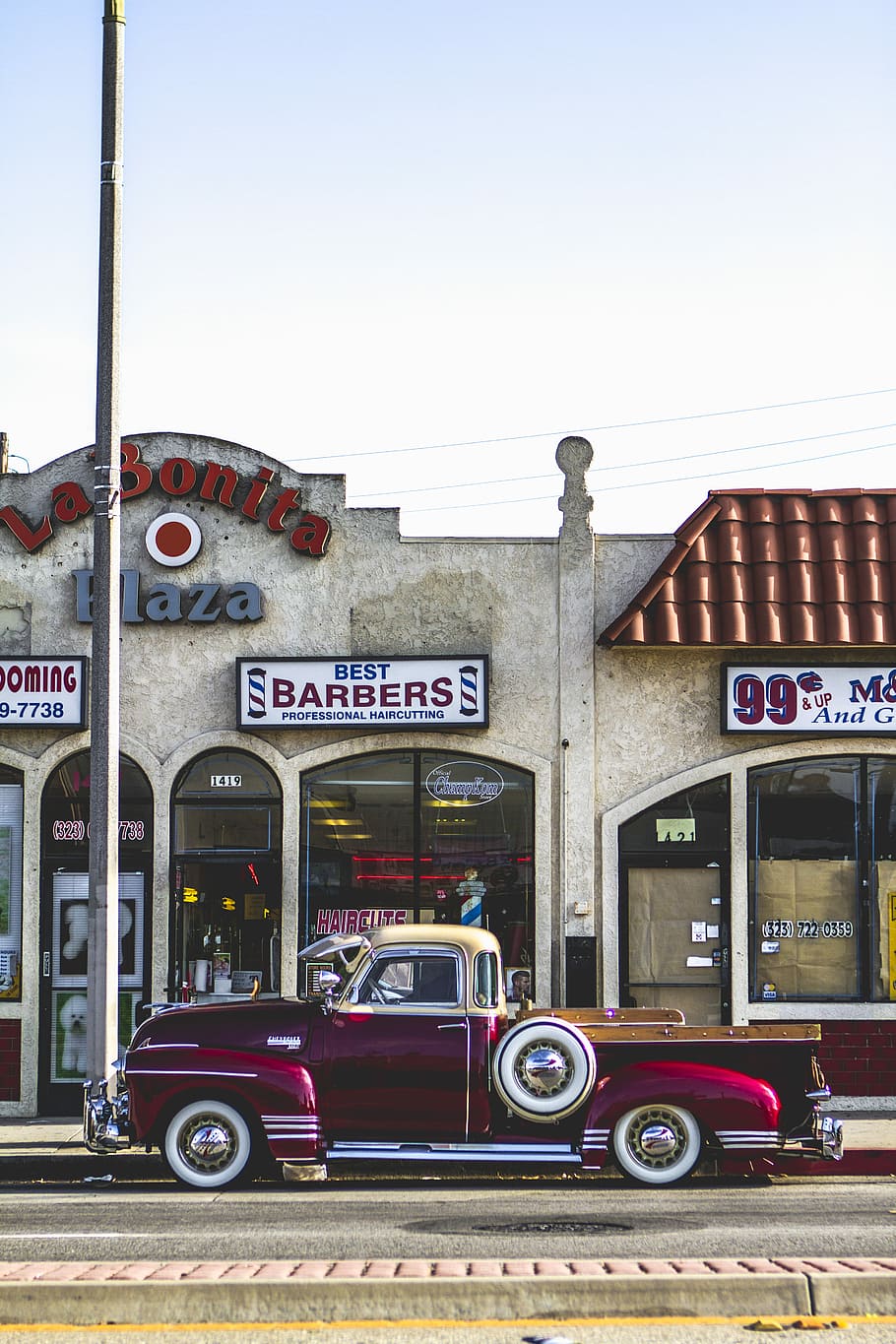 classic red coupe parked beside barber store facade, truck parked in front of La Bonita Plaza shopt, HD wallpaper