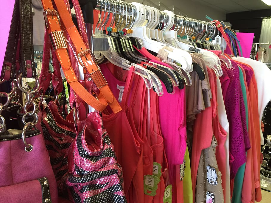 assorted-color dresses hanged on silver clothes rack, clothing