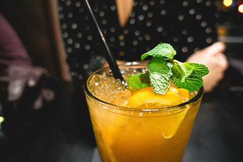 Orange juice drink with mint, bar, close up, hands, cocktail HD wallpaper