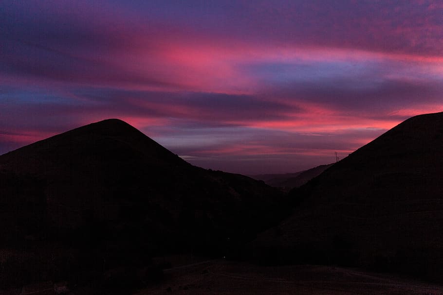 silhouette of mountains during sunset, silhouette of hill under pink and gray sky HD wallpaper