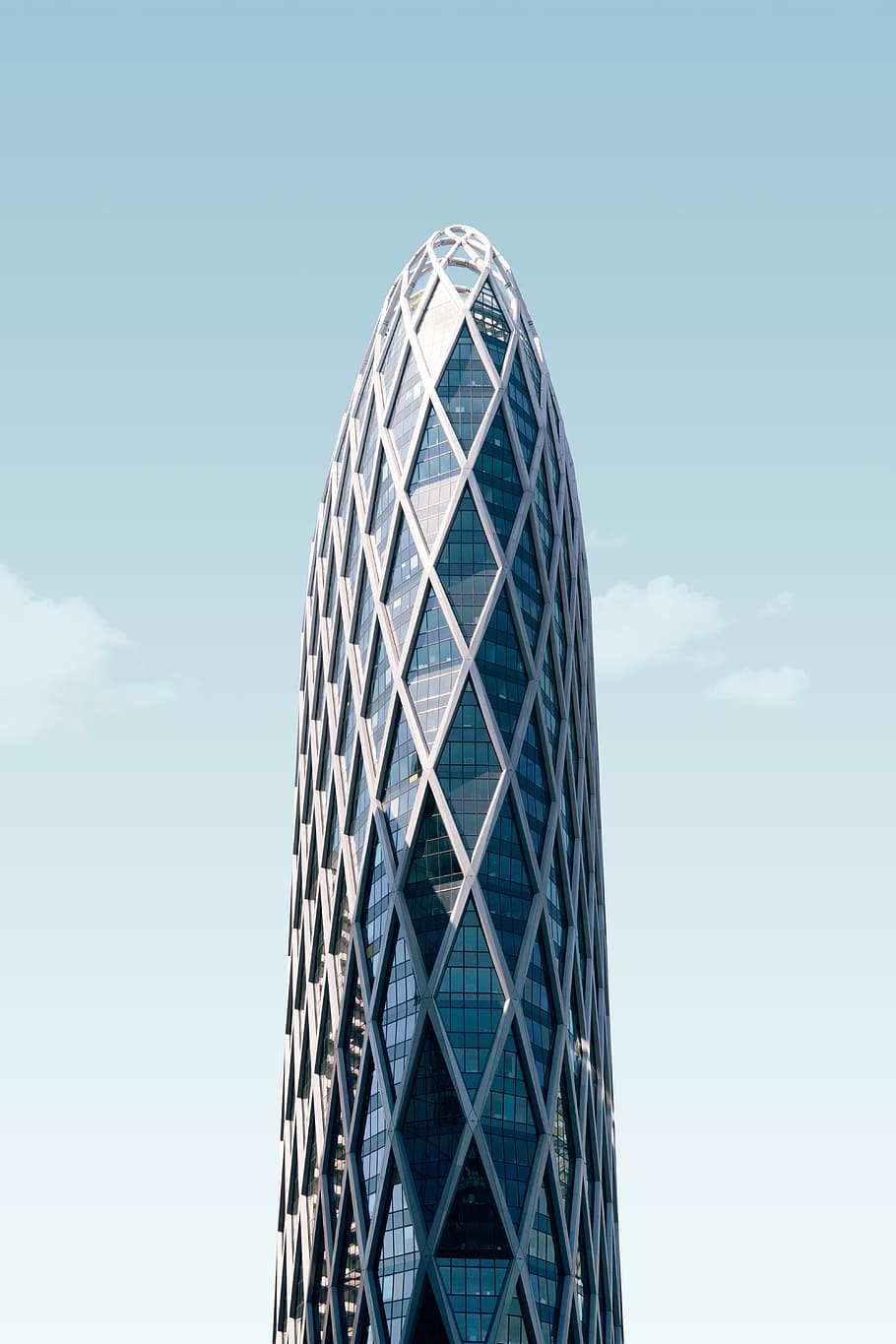 white concrete building during day tme, tall glass building under blue sky HD wallpaper