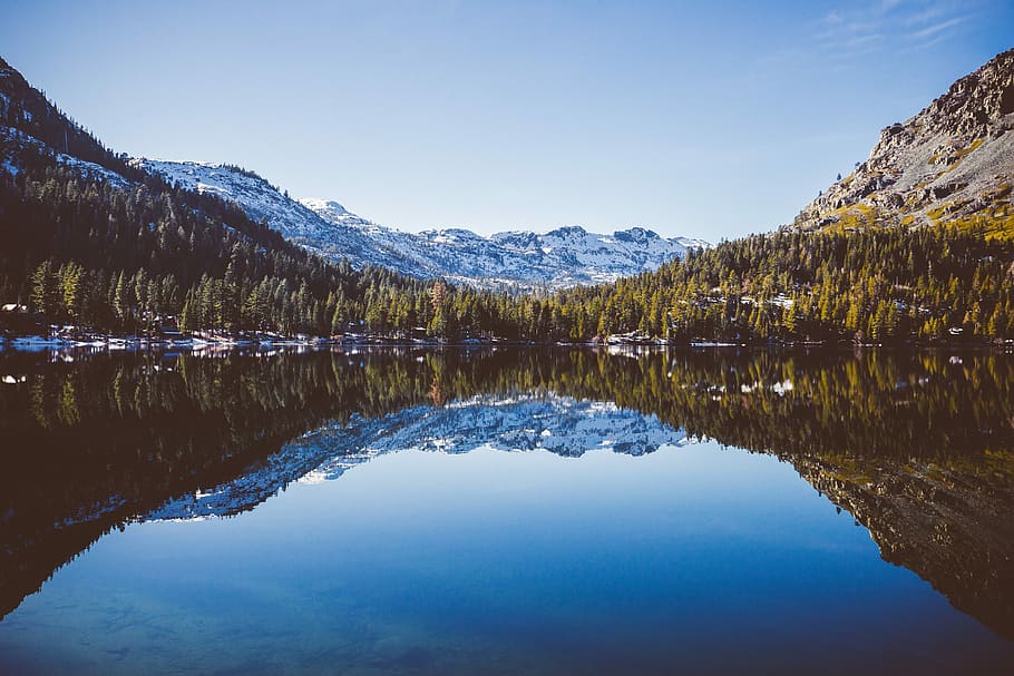 calm body of water between mountain, mountain reflect on body of water during daytime HD wallpaper