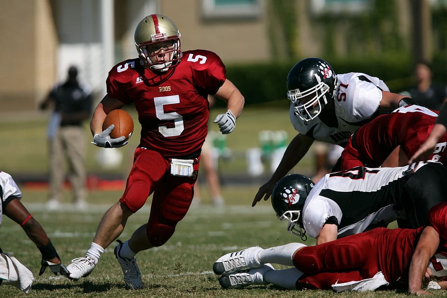 man playing football, american football, running back, football player