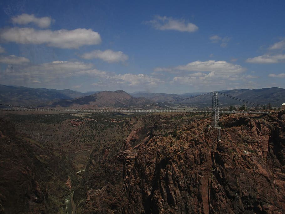 hanging bridge between rock cliffs, mountain, structire, sky, HD wallpaper