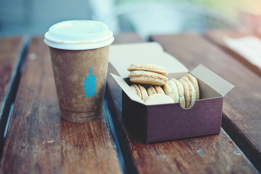assorted pastry in box beside brown disposable plastic cup, coffee HD wallpaper