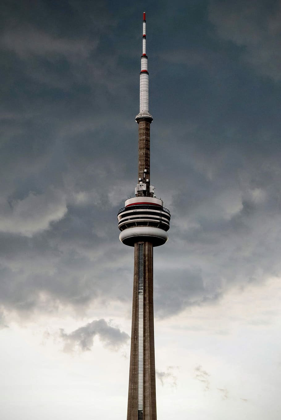 brown and white space needle with gray clouds during daytime HD wallpaper
