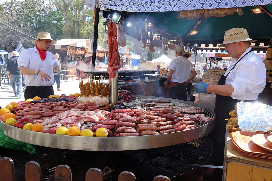 man standing in front of round industrial griller, argentine barbeque, HD wallpaper