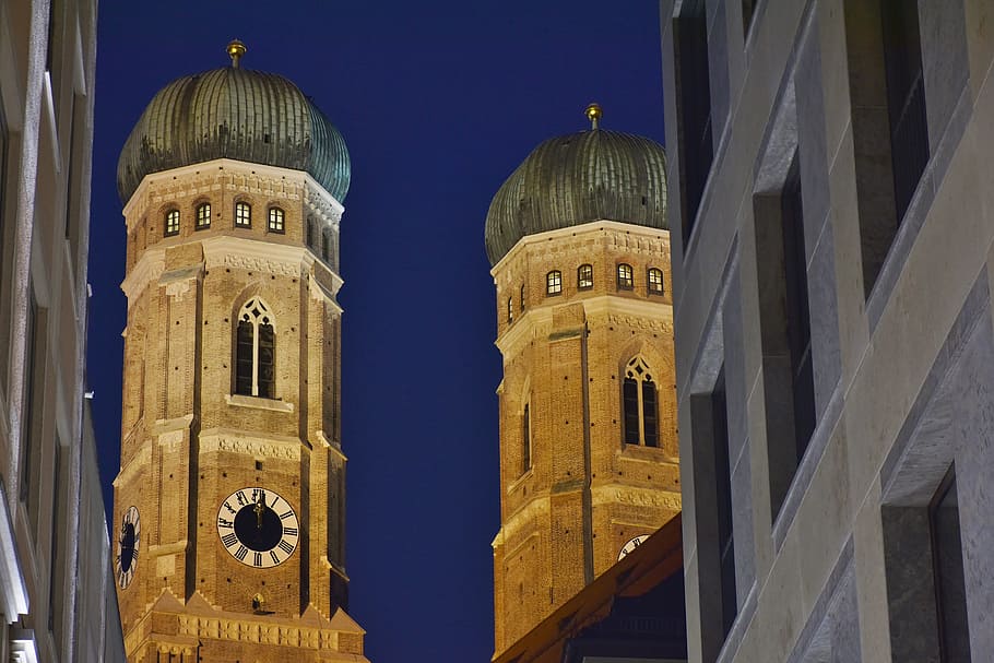brown concrete tower at night time, frauenkirche, munich, towers