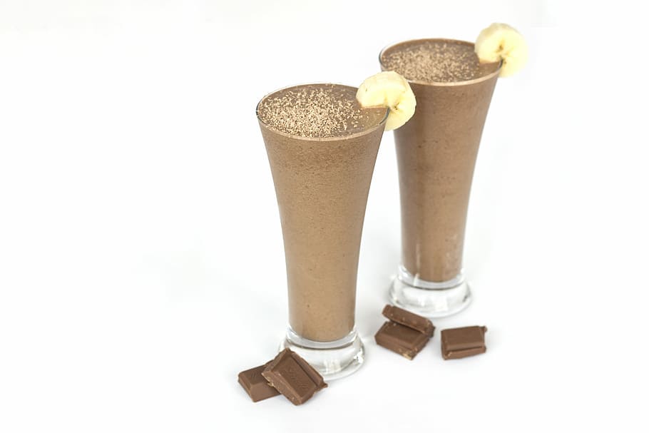 HD wallpaper: two chocolate shakes with sliced of bananas ...