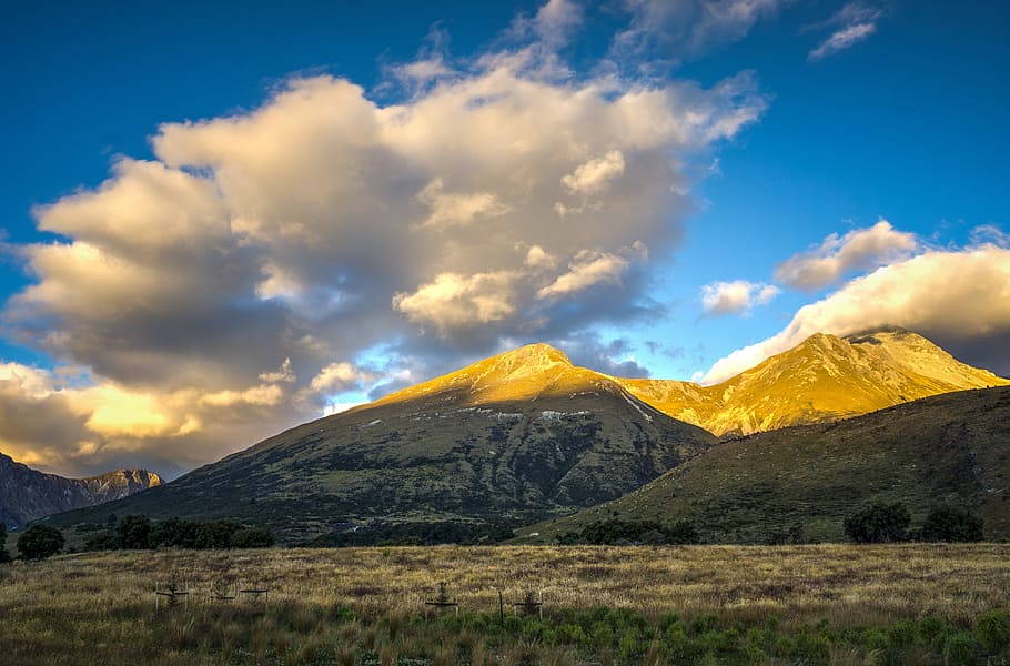 white nimbus cloed with beige and brown mountains, sky, clouds HD wallpaper
