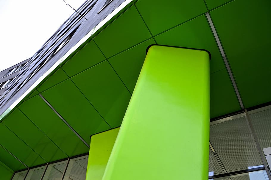 low-angle photo of green and gray concrete building at daytime HD wallpaper