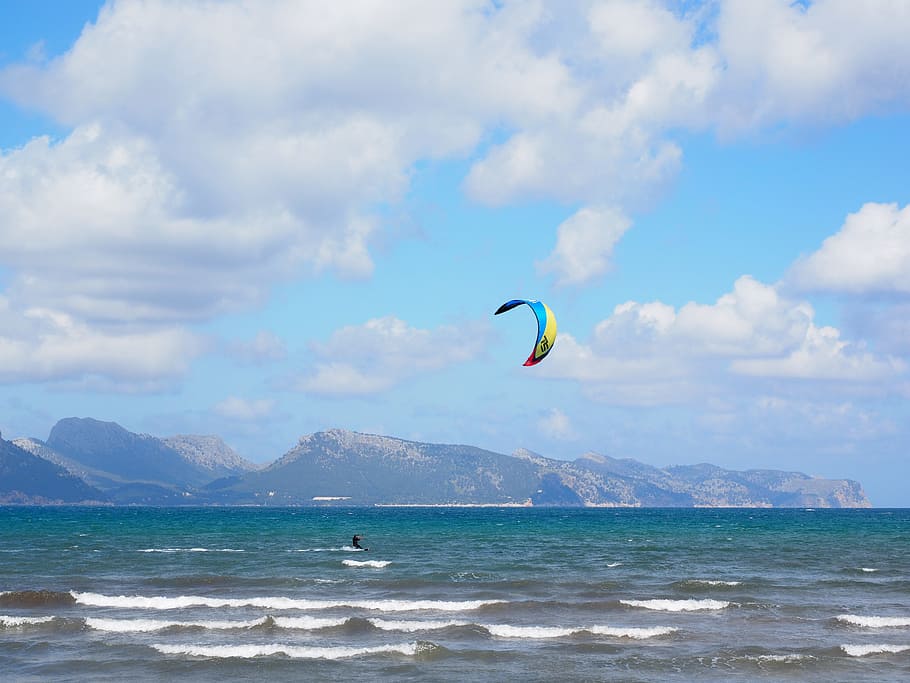 person wakeboarding under blue sky, kitesurfer, sport, sea, wind