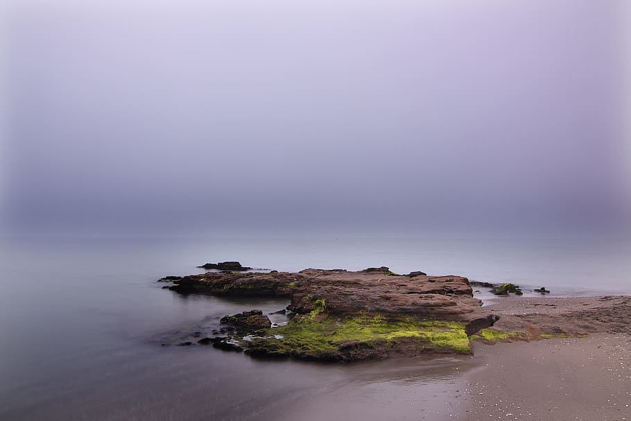 landscape photography of green grass field, landscape photography of rock formation surrounded by body of water HD wallpaper