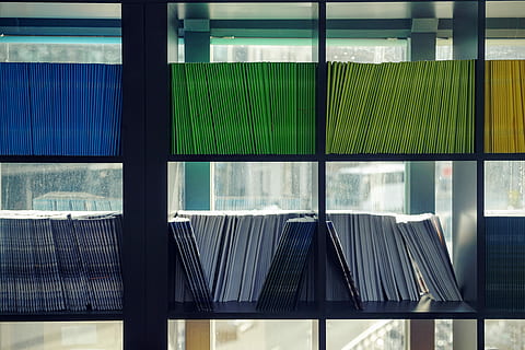 assorted-color book lot, assorted book lot on black wooden storage cube unit HD wallpaper