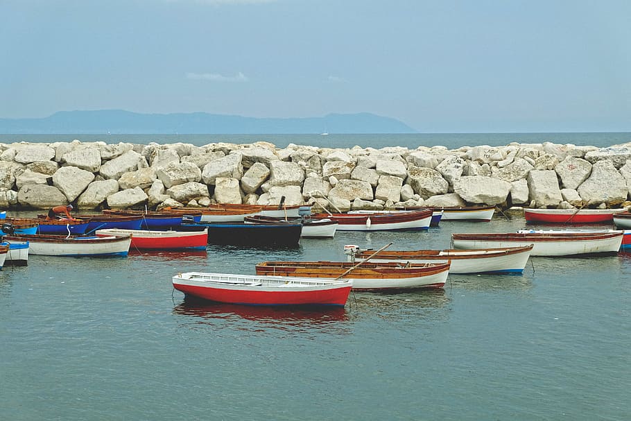 boats dock near the rocks, photo of boats on body of water, canoes HD wallpaper