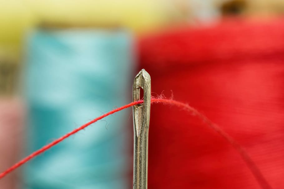 selective focus photography of red thread in needle, sewing, tailoring