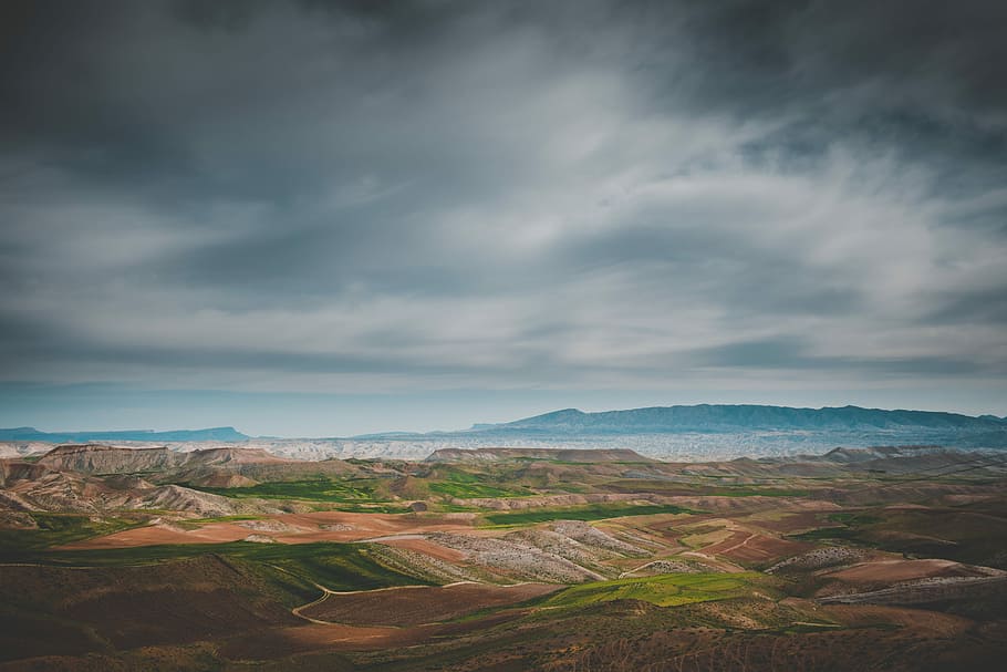 grass and soil covered field during day, landscape view of land form HD wallpaper