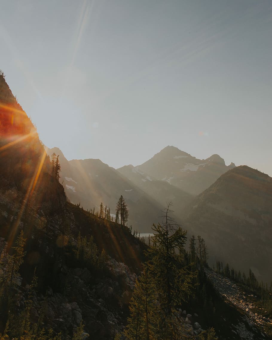 photo of mountain during sunrise, low angle photo of mountains taken at daytime HD wallpaper