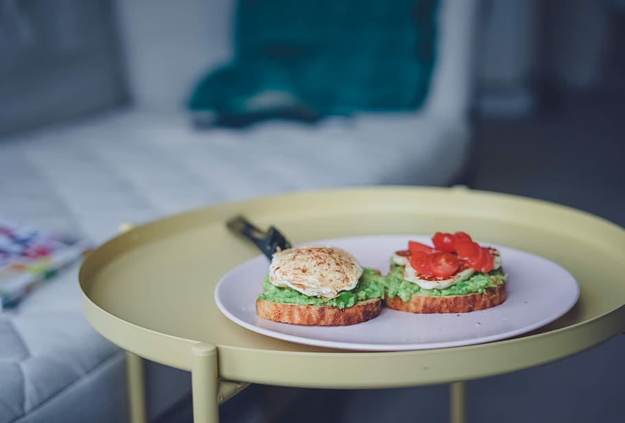 shallow focus photography of vegetable sandwich on plate, burger slice on white plate HD wallpaper