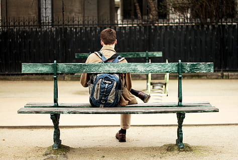 man in brown shirt sitting on bench, man sitting on green wooden bench HD wallpaper