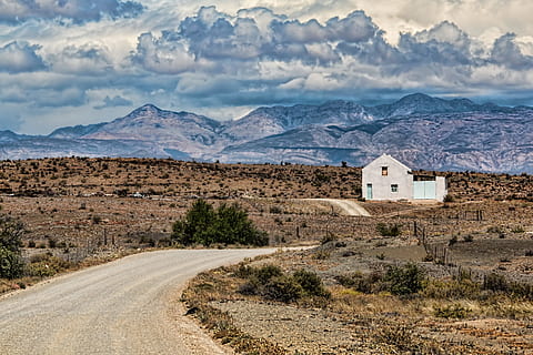 grey paint house with brown mountain top view in a distance HD wallpaper