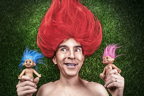 person with red hair holding two troll toys, people, whimsical HD wallpaper