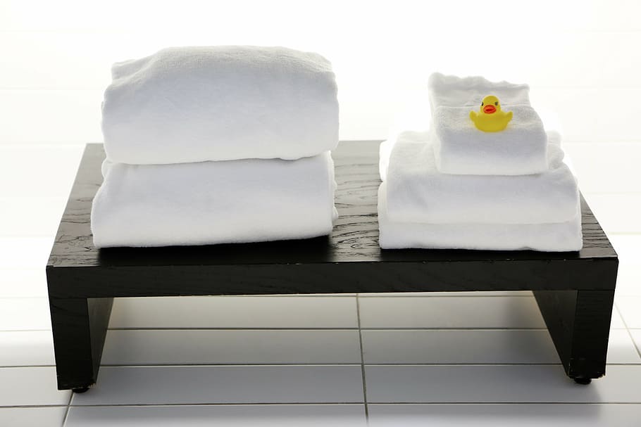 white textiles on black wooden table, yellow, rubber, duck HD wallpaper