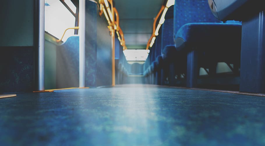 low angle photography of blue vehicle seats inside bus, blur HD wallpaper