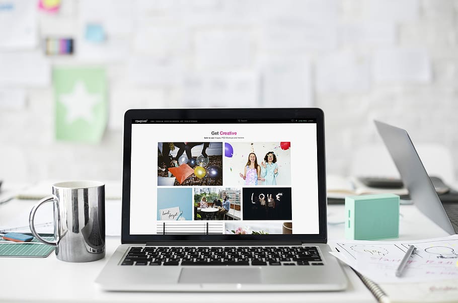 silver MacBook on table beside the mug, workplace, workspace HD wallpaper
