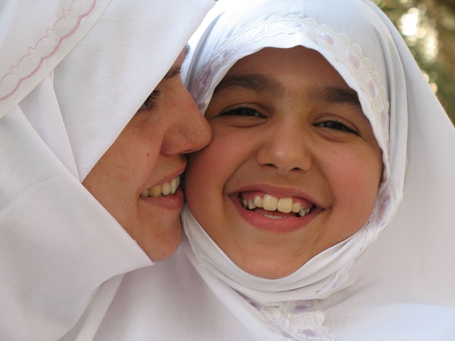 woman kissing girl on cheek, mother, daughter, muslims, women