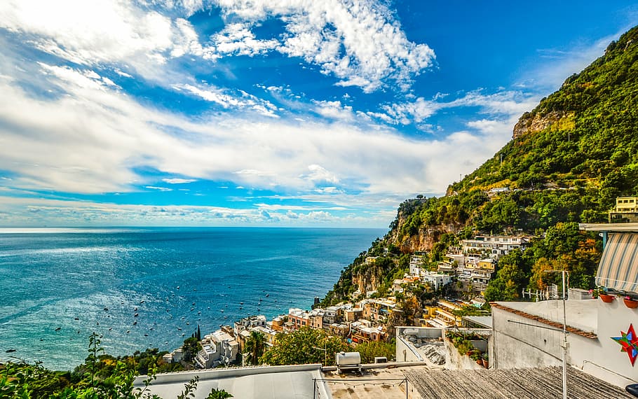 houses near sea under blue sky, amalfi, coast, sorrento, positano