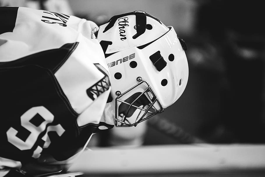 grayscale photo of ice hockey player, black and white, sport